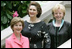 Mrs. Laura Bush stands with Lynda Bird Johnson Robb, center, and Mrs. Lynne Cheney inside the United States Botanic Garden in Washington, D.C., at the Senate spouse's luncheon Tuesday, June 3, 2008.