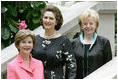 Mrs. Laura Bush stands with Lynda Bird Johnson Robb, center, and Mrs. Lynne Cheney inside the United States Botanic Garden in Washington, D.C., at the Senate spouse's luncheon Tuesday, June 3, 2008.