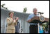 President George W. Bush and Laura Bush are seen on stage as they welcome guests to the annual Congressional Picnic on the South Lawn of the White House, Thursday evening, June 5, 2008, hosted for members of Congress and their families.