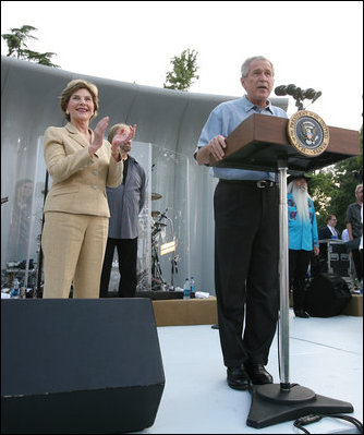 President George W. Bush and Laura Bush are seen on stage as they welcome guests to the annual Congressional Picnic on the South Lawn of the White House, Thursday evening, June 5, 2008, hosted for members of Congress and their families.