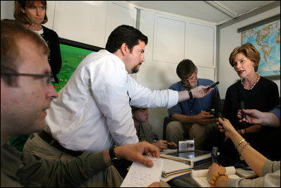 Mrs. Laura Bush talks to press aboard the airplane on Saturday, June 7, 2008, en route to Afghanistan for an unannounced visit. During her third visit to the country, Mrs. Bush plans to underscore the strong and sustained commitment of the United States and witness the progress being made in the rebuilding efforts of Afghanistan.