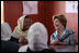 Mrs. Laura Bush smiles as she meets Sunday, June 6, 2008, with female graduates of the Police Training Academy in Bamiyan province in Afghanistan. With her is Bamiyan Governor Habiba Sarabi.