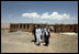 Mrs. Laura Bush is joined by Governor of Bam iran Province, Habiba Sarabi, right, and students, during a tour of the future site of the Ayenda Learning Center Sunday, June 8, 2008, in Bamiyan, Afghanistan.The tour was led by Ihsan Ullah Bayat, far left. Once completed, the Ayenda Learning Center will provide a safe and nurturing environment for 128 of Bamiyan most disadvantaged children to live. At the same time, it will provide educational opportunities for as many as 210 children in the region.