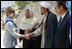 Mrs. Laura Bush meets with local leaders as she arrives June 9, 2008 at the Bamiyan Bazaar in Afghanistan to inaugurate work on the road project.