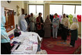 Mrs. Laura Bush speaks with Afghan women entrepreneurs during her visit to the marketplace of Arzu and Bamiyan Women's Business Association Sunday, June 8, 2008, in Afghanistan.