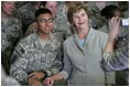 Mrs. Laura Bush poses for a photo with a US soldier during her visit to Bagram Air Force Base Sunday, June 8, 2008, in Bagram, Afghanistan.