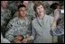 Mrs. Laura Bush poses for a photo with a US soldier during her visit to Bagram Air Force Base Sunday, June 8, 2008, in Bagram, Afghanistan.