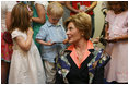 Mrs. Laura Bush talks to children during her visit to the United States Embassy Tuesday, June 10, 2008, in Kranj, Slovenia.