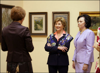 Mrs. Laura Bush and Slovenia's First Lady Barbara Miklic Turk listen as Dr. Barbara Jaki, right, conducts a tour of the impressionists exhibit at the National Gallery of Slovenia Tuesday, June 10, 2008 in Ljubljana, Slovenia.