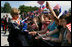 Mrs. Laura Bush is greeted by children waving flags as she and President George W. Bush arrive Tuesday, June 10, 2008, to attend the Lipizzaner Horse Exhibition at Brdo Castle in Kranj, Slovenia.