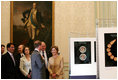 Mrs. Laura Bush participates in a viewing of the National Geographic Exhibits on Afghanistan led by Dr. Fredrick Hiebert, Archaeologist and Curator, National Geographic, Wednesday, June 11, 2008, during her visit to the Ambassador's Residence in Paris. Mrs. Bush is joined by U.S. Ambassador to France, Craig Stapleton, and his wife, Dorothy Stapleton.