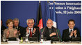 Mrs. Laura Bush joins in the applause during the U.S.-Afghan Donor's Conference Thursday, June 12, 2008 in Paris, where Mrs. Bush addressed the conference urging continued support for the Afghanistan people to build civic and economic institutions that can withstand the forces of oppression. Mrs. Bush is joined on the panel, from left, Afghanistan Foreign Minister Dr. Rangin Dadfar Spanta, Afghanistan President Hamid Karzai and French President Nicholas Sarkozy.