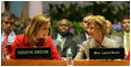 Mrs. Laura Bush talks with World Food Program Executive Director Josette Sheeran during the plenary session at the WFP conference Thursday, June 12, 2008, in Rome.