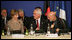 Mrs. Laura Bush, seated next to Afghanistan Foreign Minister Dr. Rangin Dadfar Spanta, speaks with Afghanistan President Hamid Karzai, right, during the U.S.-Afghan Donor's Conference Thursday, June 12, 2008, in Paris.