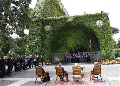 President George W. Bush and Mrs. Laura Bush join Pope Benedict XVI and Cardinal Tarcisio Bertone, Secretary of State, Vatican, as they watch a performance by The Pontifical Sistine Choir Friday, June 13, 2008, in the Lourdes Grotto at the Vatican.