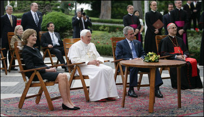 President George W. Bush and Mrs. Laura Bush meet June 13, 2008 in the Vatican Gardens with Pope Benedict XVI and Vatican Secretary of State Cardinal Tarcisio Bertone, where they watch the performance of The Pontifical Sistine Choir. 