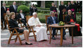 President George W. Bush and Mrs. Laura Bush meet June 13, 2008 in the Vatican Gardens with Pope Benedict XVI and Vatican Secretary of State Cardinal Tarcisio Bertone, where they watch the performance of The Pontifical Sistine Choir. 