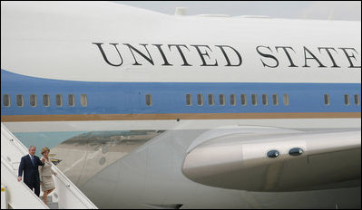 President George W. Bush and Laura Bush walk down the stairs from Air Force One on their arrival Friday, June 13, 2008, to Orly Airport in Paris.