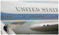 President George W. Bush and Laura Bush walk down the stairs from Air Force One on their arrival Friday, June 13, 2008, to Orly Airport in Paris.