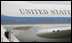 President George W. Bush and Laura Bush walk down the stairs from Air Force One on their arrival Friday, June 13, 2008, to Orly Airport in Paris.