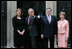 President George W. Bush waves to members of the media as he and Laura Bush are met by British Prime Minster Gordon Brown and his wife, Sarah, on their arrival Sunday, June 15, 2008 to 10 Downing Street in London.