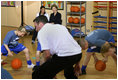 Mrs. Laura Bush watches a basketball demonstration at the Lough View Integrated Primary School's Gym in Belfast, Northern Ireland, June 16, 2008, during her visit to the school with President Bush. 