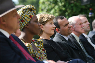 Mrs. Laura Bush listens to participants during a celebration of World Refugee Day Friday, June 20, 2008, in the East Garden of the White House. The event acknowledged the compassion of the American people in welcoming refugees into U.S. society and highlighting their contributions.