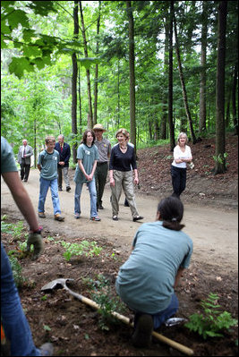 Mrs. Laura Bush walks on a trail in the Marsh-Billings-Rockefeller National Historical Park Monday, June 23, 2008, in Woodstock, Vt. With her are Rolf Diamant, park superintendent, and students of the Service-Learning program. President Bush has proclaimed 2008 as Great Outdoors Month to celebrate the grandeur of our open spaces, strengthen our commitment to preserving this heritage, and reaffirm our dedication to protecting our air, water, and lands.