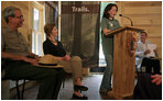 Mrs. Laura Bush listens to Rachel Allen, a student in the Service-Learning Program, as she delivers remarks during an Active Trails! event at Marsh-Billings-Rockefeller National Historical Park Monday, June 23, 2008, in Woodstock, Vt. Also shown are Rolf Diamant, Superintendent of Marsh-Billings-Rockefeller National Historical Park, and Vin Cipolla, President of the National Parks Foundation. Mr. Cipolla just announced a $50, 000 grant from the National Park Foundation to the Marsh-Billings-Rockefeller National Historical Park to connect the Forest Center to the Woodstock Trails Network.