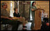 Mrs. Laura Bush listens to Rachel Allen, a student in the Service-Learning Program, as she delivers remarks during an Active Trails! event at Marsh-Billings-Rockefeller National Historical Park Monday, June 23, 2008, in Woodstock, Vt. Also shown are Rolf Diamant, Superintendent of Marsh-Billings-Rockefeller National Historical Park, and Vin Cipolla, President of the National Parks Foundation. Mr. Cipolla just announced a $50, 000 grant from the National Park Foundation to the Marsh-Billings-Rockefeller National Historical Park to connect the Forest Center to the Woodstock Trails Network.