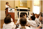 During remarks, Mrs. Bush calls on a student to name a type of plant they planted earlier in the day during National Park First Bloom event at the Charlestown Navy Yard in Boston, MA, Sunday, June 22, 2008.