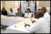 Mrs. Laura Bush attends a briefing Thursday, March 13, 2007 at the GHESKIO HIV/AIDS Center in Port-au-Prince, Haiti. GHESKIO is a participant in the President's Emergency Plan for AIDS Relief (PEPFAR), which has contributed approximately $365 million to fight HIV/AIDS in Haiti.