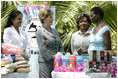 Mrs. Laura Bush is introduced to a participant in the micro-credit program developed at the GHESKIO HIV/AIDS Center's women's clinic, Thursday, March 13, 2007, in Port-au-Prince, Haiti. The program was initiated to help improve the lives of HIV patients.