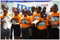 A choir sings a welcome song for Mrs. Laura Bush during her visit to the IDEJEN educational program at the College de St. Martin Tours Thursday, March 13, 2007, in Port-au-Prince, Haiti.