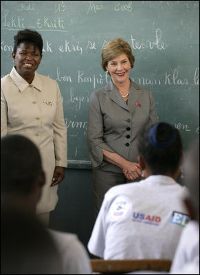 Mrs. Laura Bush visits students enrolled in the IDEJEN educational program at the College de St. Martin Tours Thursday, March 13, 2007, in Port-au-Prince, Haiti. Speaking to the program's faculty and staff Mrs. Bush said, "Educating its young people is one of the best things a country can do to ensure its continued development."