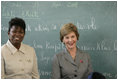 Mrs. Laura Bush visits students enrolled in the IDEJEN educational program at the College de St. Martin Tours Thursday, March 13, 2007, in Port-au-Prince, Haiti. Speaking to the program's faculty and staff Mrs. Bush said, "Educating its young people is one of the best things a country can do to ensure its continued development."