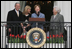 Mrs. Laura Bush, joined by President George W. Bush, daughter, Jena, and former first lady Barbara Bush, welcomes guests Monday, March 24, 2008 to the South Lawn of the White House, for the 2008 White House Easter Egg Roll.