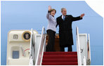 President George W. Bush and Mrs. Laura Bush wave as they board Air Force One Monday, March 31, 2008, for departure to Kyiv, Ukraine, the first stop on their European visit that will include the NATO Summit in Bucharest. 