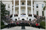 President George W. Bush and Mrs. Laura Bush pose for a photo Saturday evening, March 29, 2008 on the South Portico of the White House, with Mrs. Bush's classmates from the Midland High School graduating class of 1964, during their class reunion gathering at the White House.