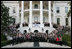 President George W. Bush and Mrs. Laura Bush pose for a photo Saturday evening, March 29, 2008 on the South Portico of the White House, with Mrs. Bush's classmates from the Midland High School graduating class of 1964, during their class reunion gathering at the White House.