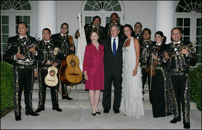 President George W. Bush and Laura Bush pose for photos with singer Shaila Durcal, Dorio Ferreira Sanchez and the Mariachi Campanas de America following their performance in the Rose Garden Monday evening, May 5, 2008, during a social dinner at the White House in honor of Cinco de Mayo.