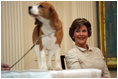 Mrs. Laura Bush smiles as the Westminster Kennel Club's 2008 Best in Show winner, Uno, is introduced to invited guests Monday, May 5, 2008, in the East Room during the beagle's visit to the White House Monday, May 5, 2008.