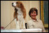 Mrs. Laura Bush smiles as the Westminster Kennel Club's 2008 Best in Show winner, Uno, is introduced to invited guests Monday, May 5, 2008, in the East Room during the beagle's visit to the White House Monday, May 5, 2008.