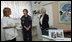 Mrs. Laura Bush and Mrs. Aliza Olmert, spouse of Israeli Prime Minister Ehud Olmert, talk with a staff member during a visit Wednesday, May 14, 2008, to the Tipat Chalav-Gonenim Neighborhood Mother and Child Care Center in Jerusalem.