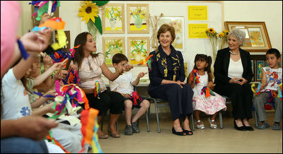 Mrs. Laura Bush joins students at Hand in Hand School for Jewish-Arab Education Wednesday, May 14, 2008, during her visit to Jerusalem. Joining her on the tour of the school that provides integrated, bilingual education to Jewish and Arab students in Israel is Mrs. Aliza Olmert, spouse of Israeli Prime Minister Ehud Olmert.