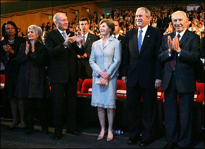 President George W. Bush and Laura Bush are applauded as they attend the Israeli Presidential Conference 2008 at the Jerusalem International Center in Jerusalem, Wednesday, May 14, 2008, during a celebration in honor of the nation's 60th anniversary. From left are U.S. Secretary of State Condoleezza Rice, Mrs. Aliza Olmert, Israeli Prime Minister Ehud Olmert, and Israeli President Shimon Peres.