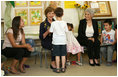 Mrs. Laura Bush shares a moment with a kindergarten student Wednesday, May 14, 2008, at the Hand in Hand School for Jewish-Arab Education in Jerusalem. Mrs. Bush took the opportunity to visit the school with Mrs. Aliza Olmert, right, spouse of Israeli Prime Minister Ehud Olmert.