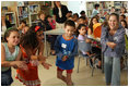 Mrs. Laura Bush looks on as second- and fifth-graders perform a Jewish and Arabic Dance at the Hand in Hand School for Jewish-Arab Education in Jerusalem. Founded in 1997, the Hand in Hand Center runs a network of four bilingual schools in Israel.