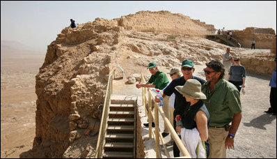 President George W. Bush and Mrs. Laura Bush stand with Mrs. Aliza Olmert, spouse of Israeli Prime Minister Ehud Olmert, as they listen to Eitan Campbell, Director of the Masada National Park, during a visit to the historic site Thursday, May 15, 2008, in Masada, Israel.