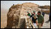 President George W. Bush and Mrs. Laura Bush stand with Mrs. Aliza Olmert, spouse of Israeli Prime Minister Ehud Olmert, as they listen to Eitan Campbell, Director of the Masada National Park, during a visit to the historic site Thursday, May 15, 2008, in Masada, Israel.